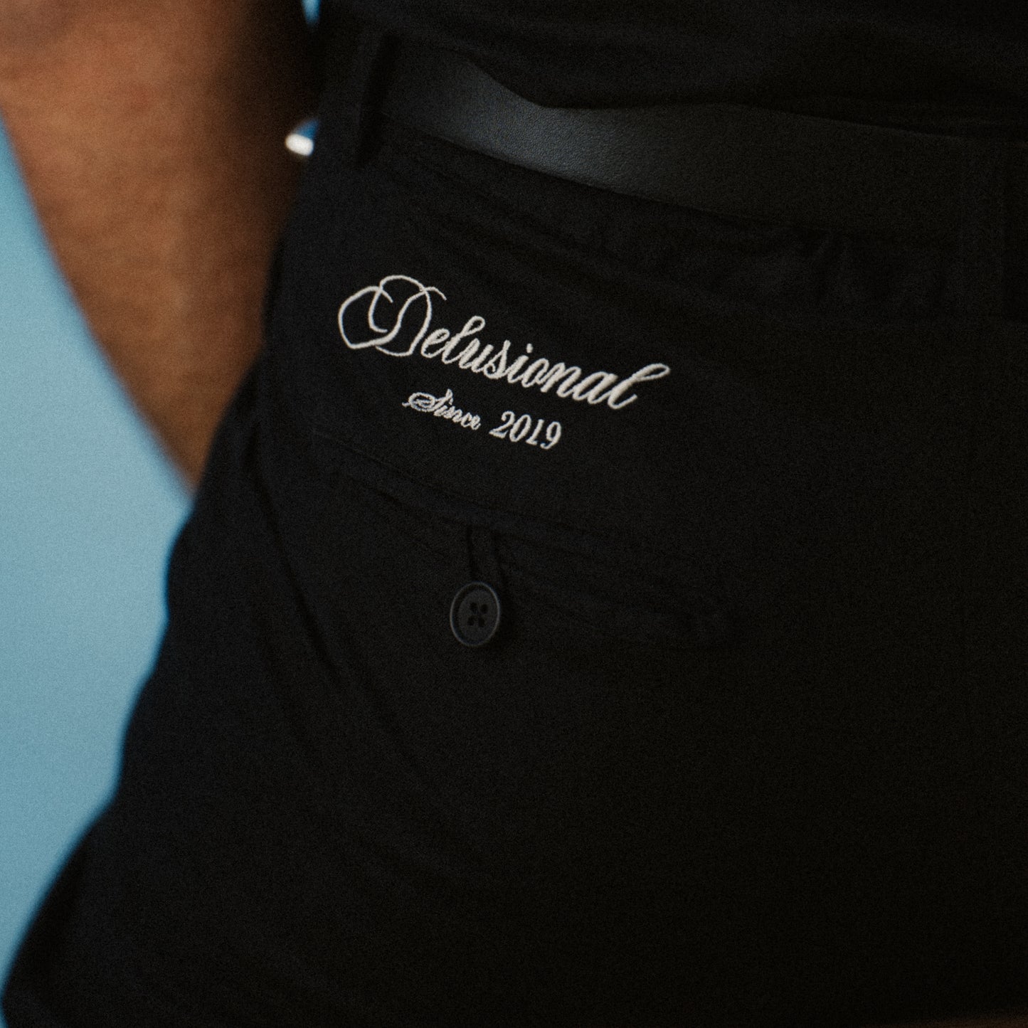 Premium linen trousers with embroidered logo detail