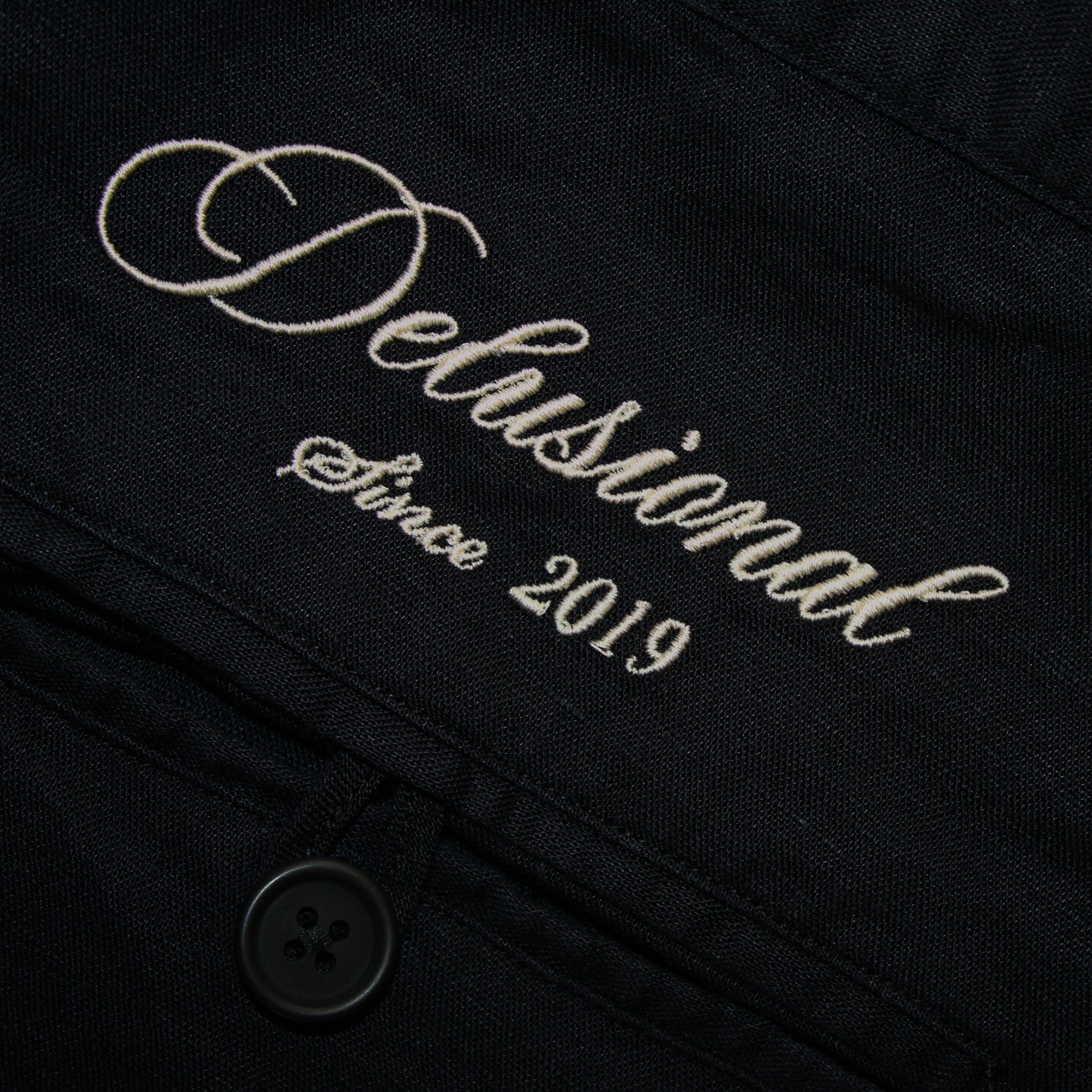 Embroidery details in men's linen trousers by Delusional