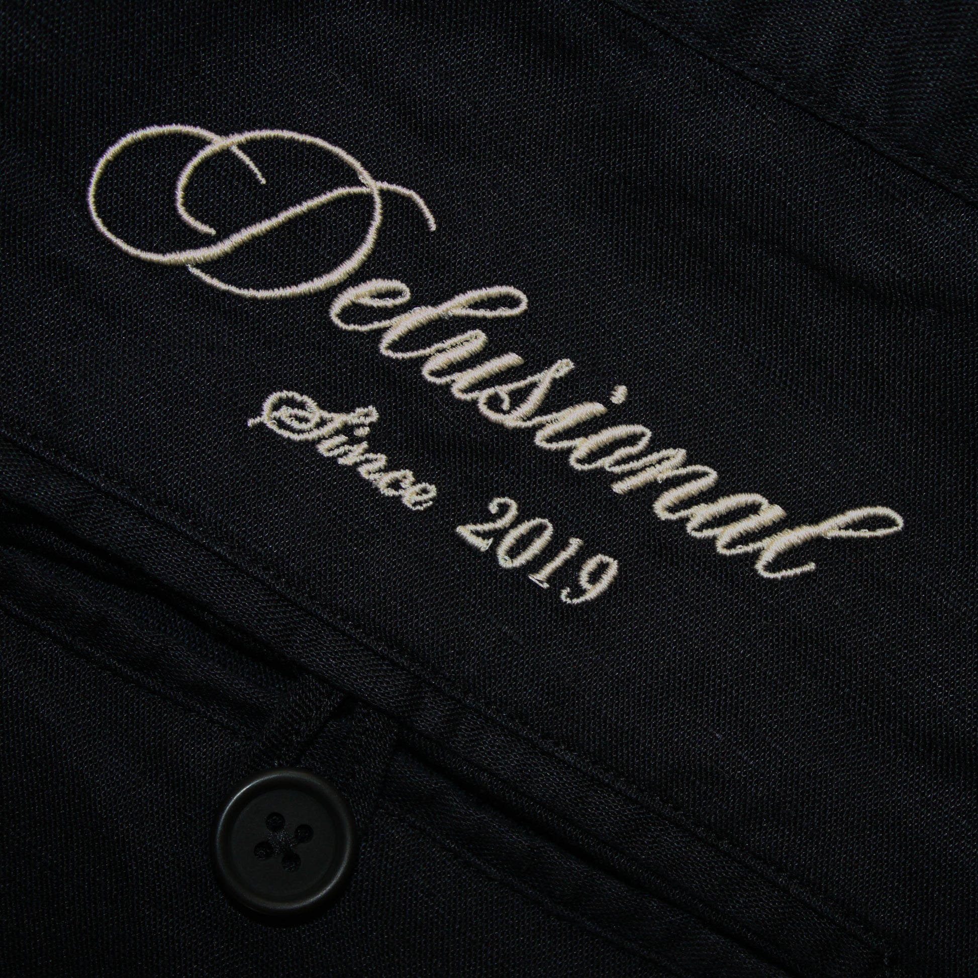 Embroidery details in men's linen trousers by Delusional
