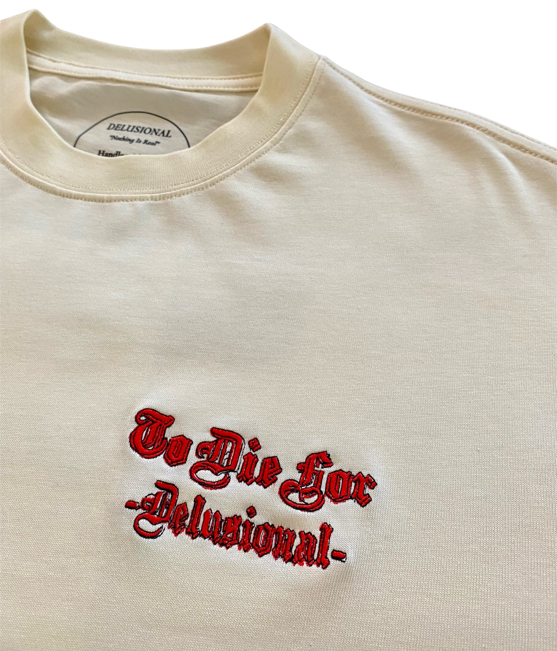 Front embroidered logo detail on premium cotton t-shirt