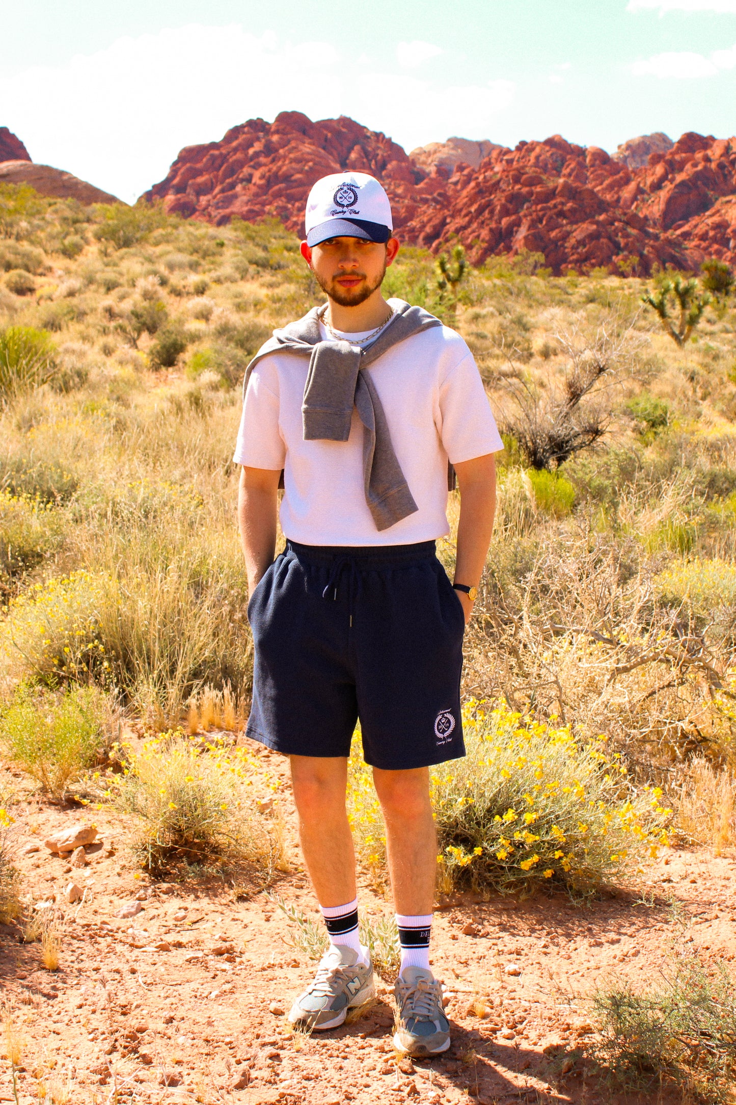 Model wearing navy Country Club Shorts by Delusional