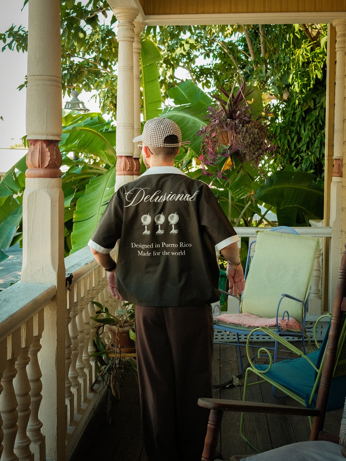 Model wearing Designed in PR button-up shirt in Puerto Rico outdoors