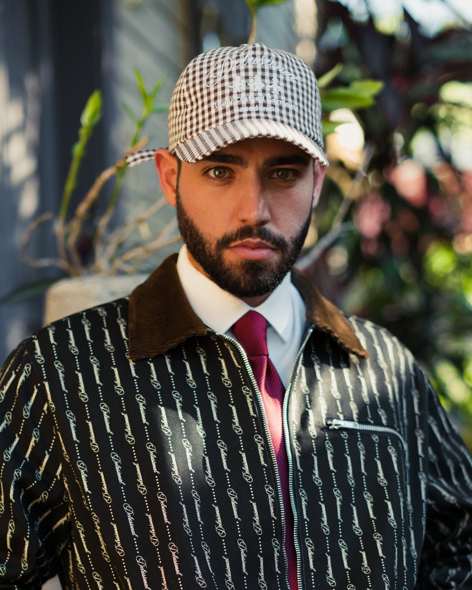 Model wearing Signature Series No. 002 hat by Delusional