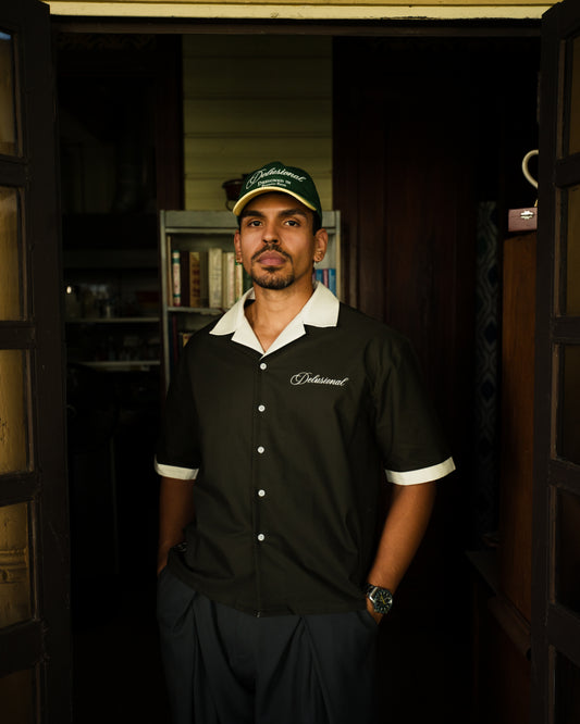 Model wearing Designed in PR two-tone cap by Delusional